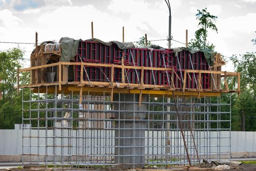 Bridge or overpass support under construction.