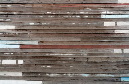 Brown wooden wall texture background. Empty old wood plank surface texture background. Timber wooden wall with brown, blue, and white colors. Exterior design. Wooden wall with nails. Weathered wood.