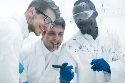 group of scientists talking in the laboratory.concept of education