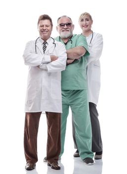 in full growth. successful female doctor standing in front of her colleagues . isolated on a white