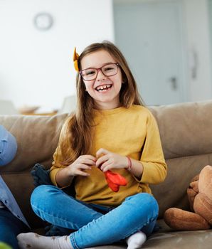 Portrait of a happy little girl at home