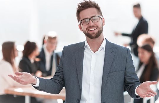 close up. confident businessman standing in his office. business concept