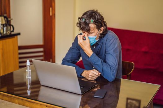 Coronavirus. Man working from home wearing protective mask. quarantine for coronavirus wearing protective mask. Working from home.