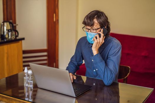 Coronavirus. Man working from home wearing protective mask. quarantine for coronavirus wearing protective mask. Working from home.