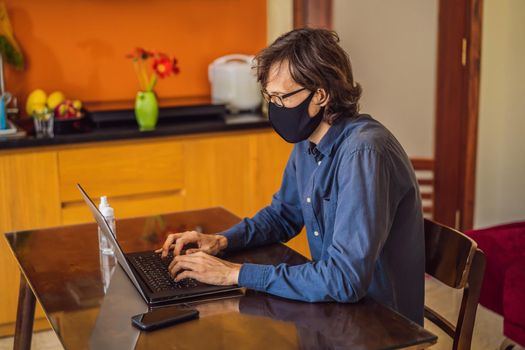 Coronavirus. Man working from home wearing protective mask. quarantine for coronavirus wearing protective mask. Working from home.