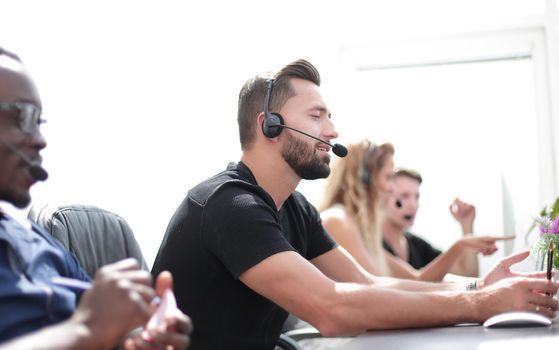 call center staff sitting at the Desk. photo with copy space