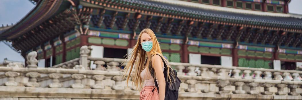 Woman tourist in medical mask in Seoul, South Korea. Travel to Korea concept Tourists fear the 2019-ncov virus. Medical masked tourists. BANNER, LONG FORMAT