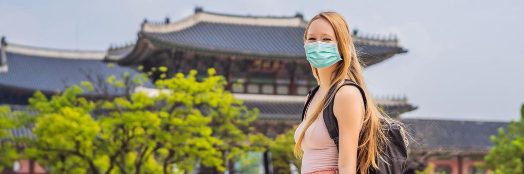 Woman tourist in medical mask in Seoul, South Korea. Travel to Korea concept Tourists fear the 2019-ncov virus. Medical masked tourists. BANNER, LONG FORMAT