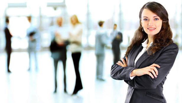 business woman with her staff, people group in background at modern bright office indoors