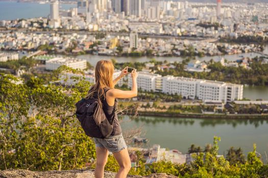 Woman tourist on the background of Nha Trang city. Travel to Vietnam Concept.