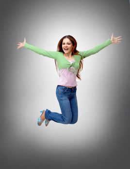 happy young woman is jumping