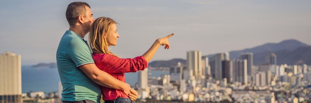 Happy couple tourists on the background of Nha Trang city. Travel to Vietnam Concept. BANNER, LONG FORMAT