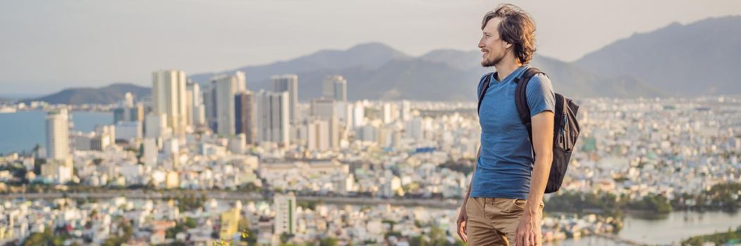 Man tourist on the background of Nha Trang city. Travel to Vietnam Concept. BANNER, LONG FORMAT