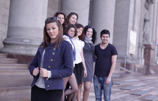 girl student on the background of the team of friends .photo with copy space