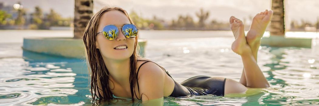 Luxury resort swimming pool. Beautiful woman tourist relaxing in holiday retreat on summer travel vacation. Bikini girl in sunbathing swimsuit enjoying ocean background. BANNER, LONG FORMAT