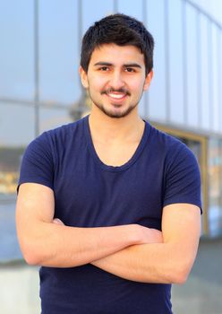 A handsome young man in plain clothes.