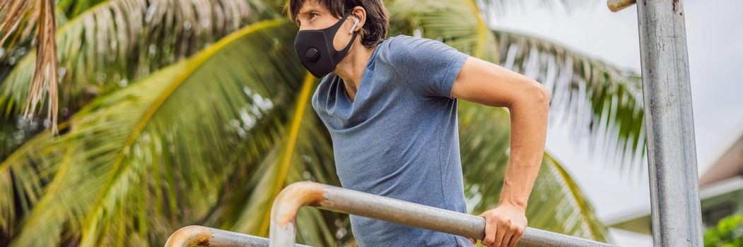 Man in a medical mask plays sports during the coronavirus epidemic. BANNER, LONG FORMAT