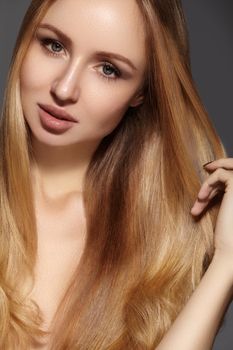 Fashion long hair. Beautiful blond girl. Healthy straight shiny hair style. Beauty woman model. Shine smooth hairstyle