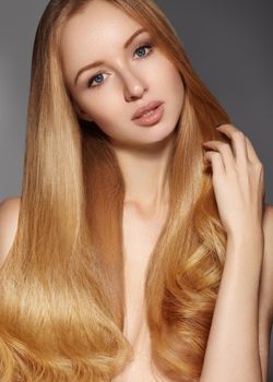 Fashion long hair. Beautiful blond girl. Healthy straight shiny hair style. Beauty woman model. Shine smooth hairstyle