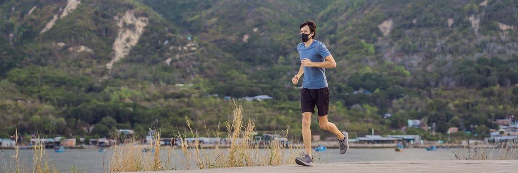 Runner wearing medical mask, Coronavirus pandemic Covid-19. Sport, Active life in quarantine surgical sterilizing face mask protection. Outdoor run on athletics track in Corona Outbreak. BANNER, LONG FORMAT