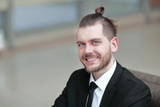 closeup. portrait of successful businessman on workplace in the office .photo with copy space