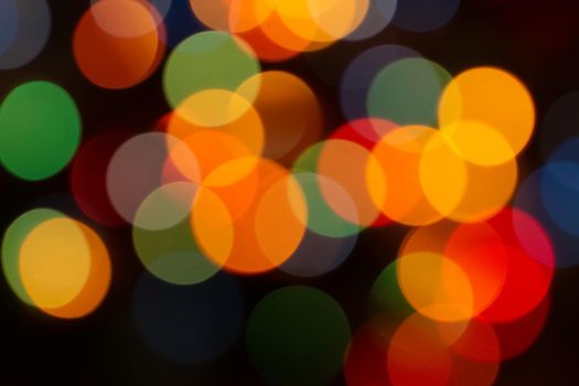 Christmas light background. Holiday glowing backdrop. Defocused Background. Blurred Bokeh.