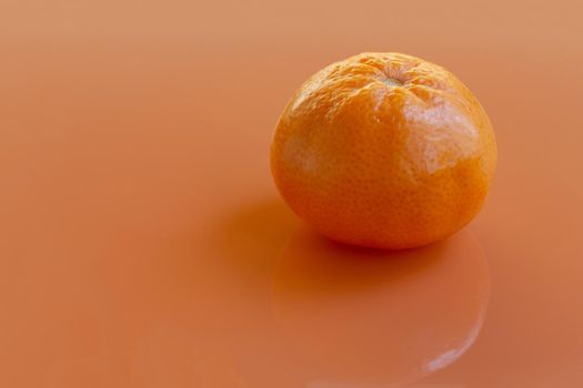 tangerine on an orange background.