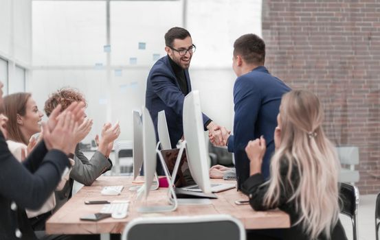 business people shaking hands at a work meeting. photo with copy space