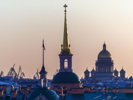 SAINT PETERSBURG. RUSSIA - JULE 23 2019. Krestovsky stadium and Lakhta Center skyscraper against bright sunset sky.