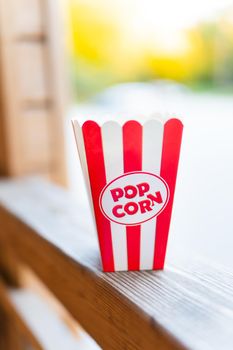 Classic red striped outdoor popcorn box. Going to the cinema