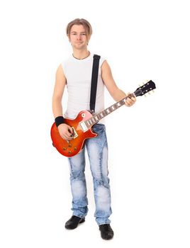portrait in full growth.a young guy with a guitar.isolated on white background