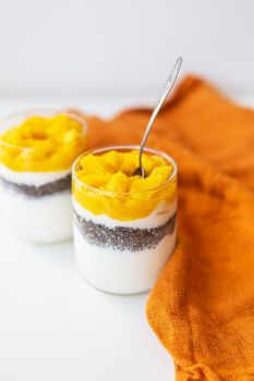 Delicious mango dessert with yogurt and chia seeds. Delicious and healthy food