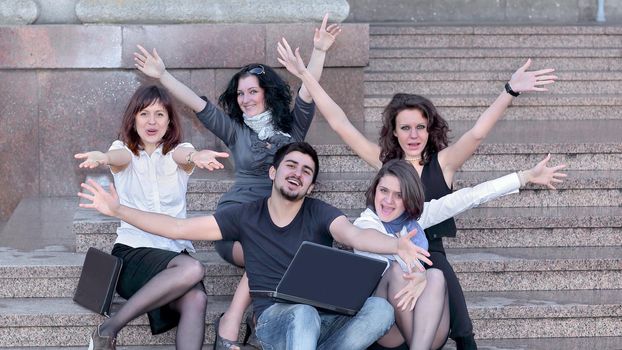 closeup..group of happy university students in front of university building