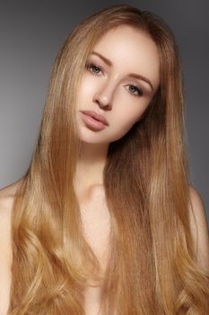 Fashion long hair. Beautiful blond girl. Healthy straight shiny hair style. Beauty woman model. Shine smooth hairstyle