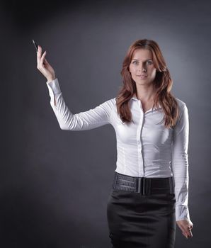 confident business woman shows up on copy space.isolated on dark background.