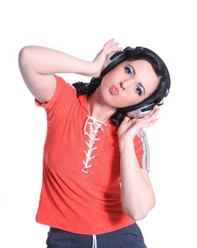 young woman listening to music using headphones.