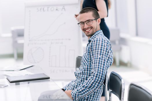 close up.young employee sitting at his Desk.photo with copy space