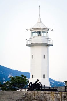 Lighthouse with an old cannon.