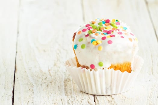 Tasty cake for holidays on a white wooden background