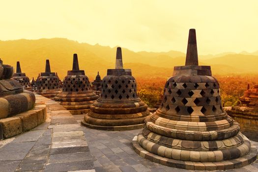 Borobudur Temple at sunset. Ancient stupas of Borobudur Temple. Yogyakarta, Central Java, Indonesia.