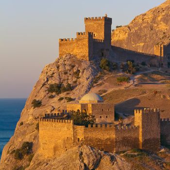 Medieval Genoese fortress on the shore of the Black Sea. The Crimean Peninsula, Ukraine. Toned image