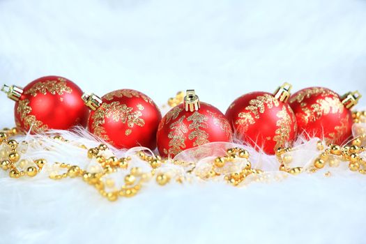 Red christmas balls with snow isolated on white