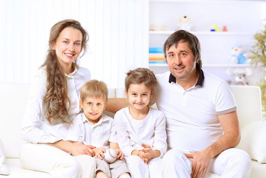 Beautiful happy family - isolated over a white background