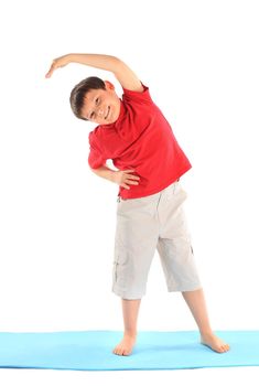 Children's yoga. The little boy does exercise.