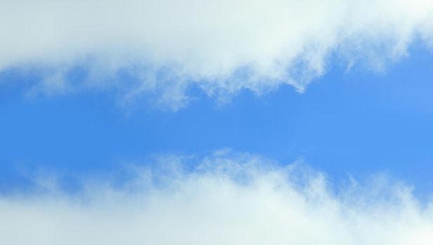 blue sky is covered by white clouds