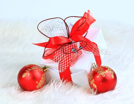 christmas gift with red balls isolated on white background