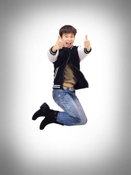 Young trendy stylish teenager jumping in joy isolated over white background.