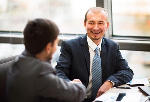 Business people shaking hands, finishing up a meeting