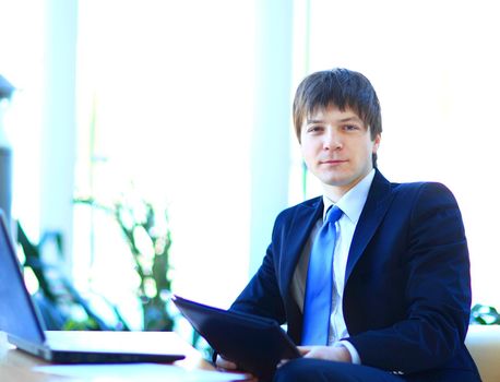 A young businessman in the office.