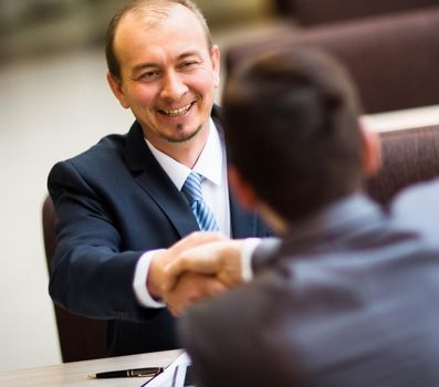 Business people shaking hands, finishing up a meeting